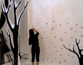 Yuko drawing snowflakes to backdrop
